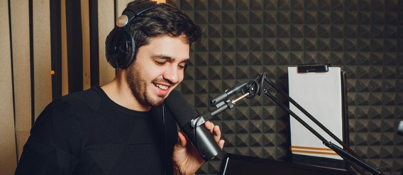 Broadcasting professional in a studio. Learn more about various broadcasting careers today.